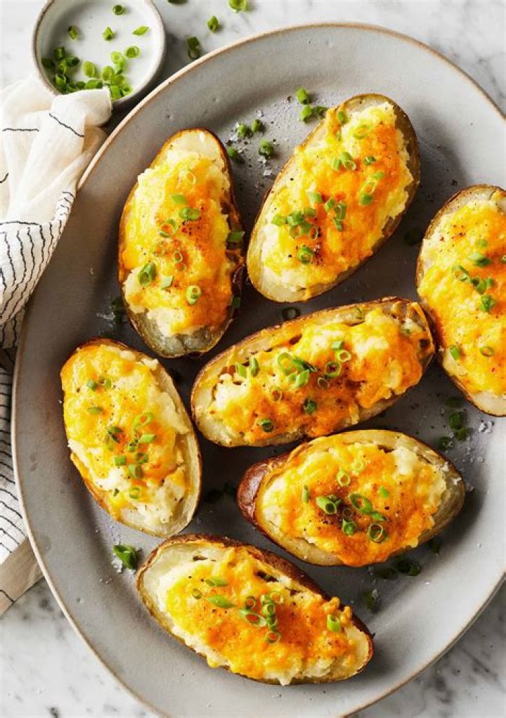 How many calories are in a baked potato with butter and cheese?